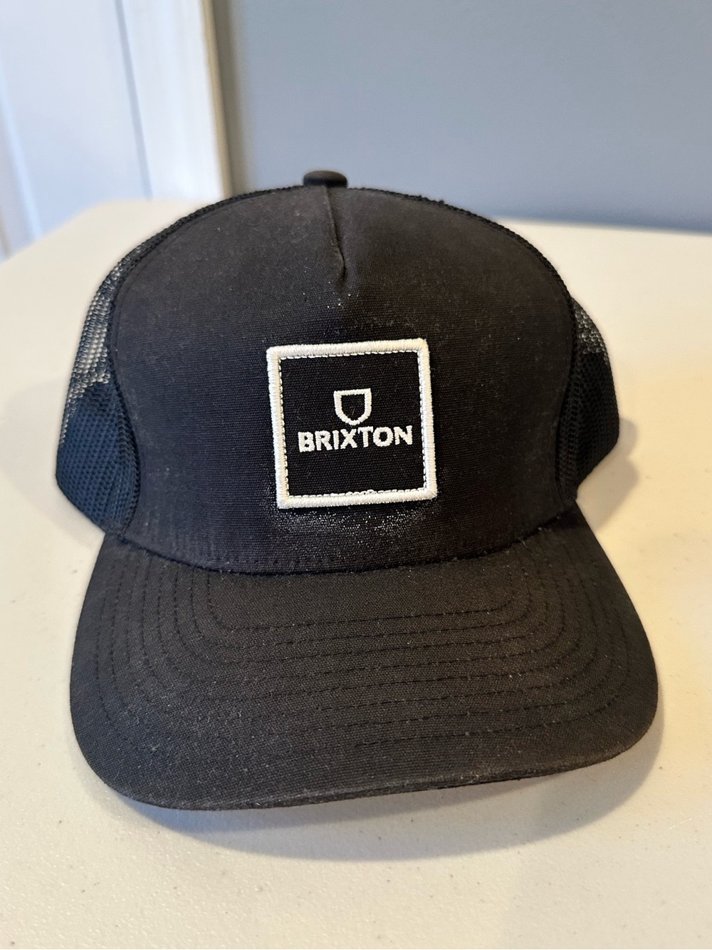 Brixton Unisex Alpha Block Netplus Trucker Hat 
In Black and White